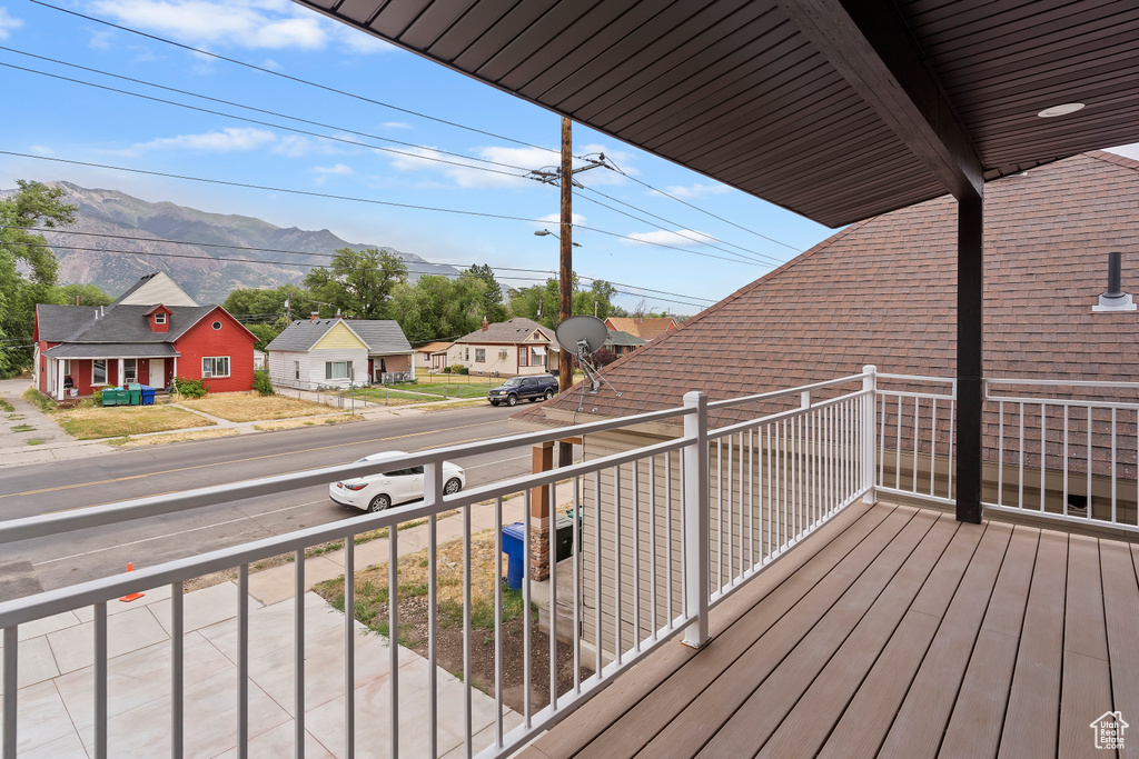 Balcony featuring a mountain view and a residential view