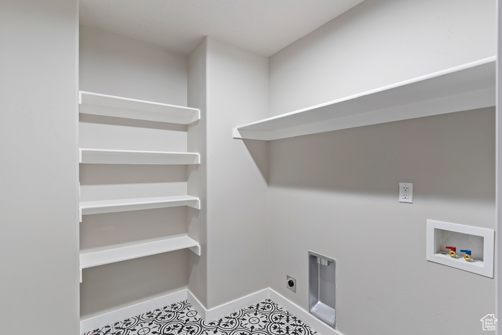 Laundry room with washer hookup, hookup for an electric dryer, and tile patterned floors