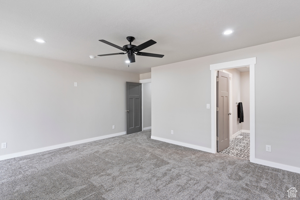 Carpeted spare room with recessed lighting and a ceiling fan