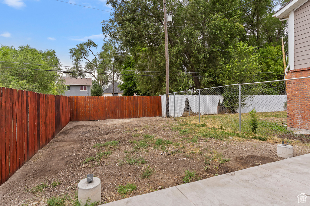 View of fenced backyard