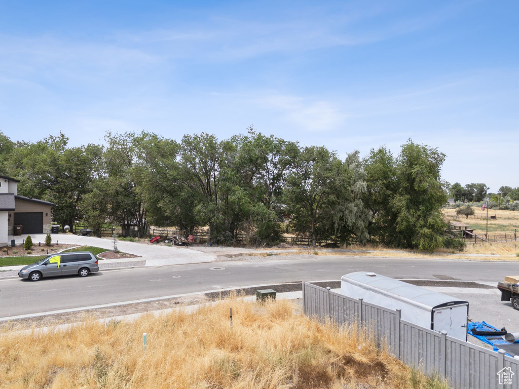 View of asphalt road with curbs