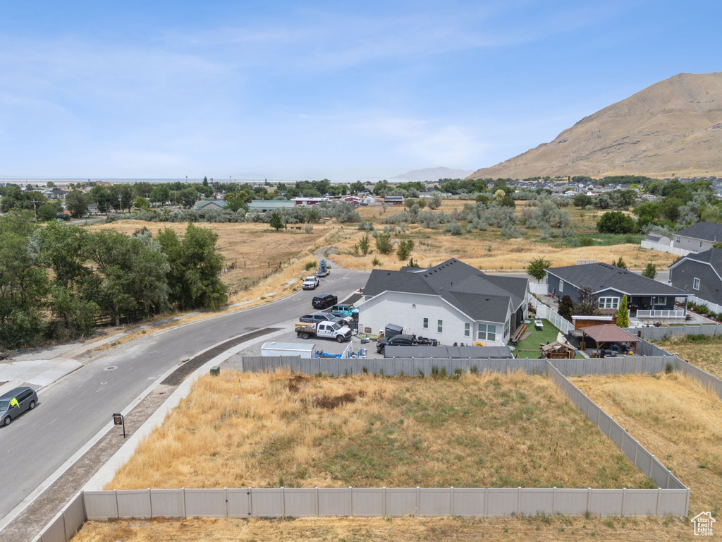 Aerial perspective of suburban area featuring a mountainous background