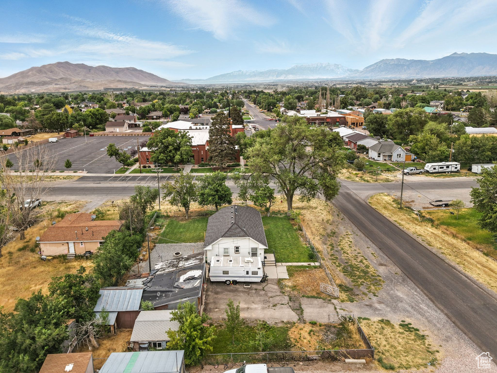 Aerial view of residential area featuring a mountainous background