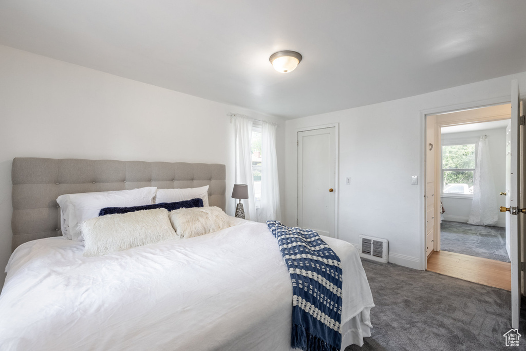 Bedroom featuring carpet flooring and a closet
