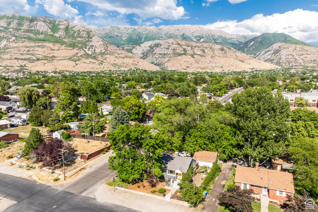 Aerial perspective of suburban area with a mountain backdrop