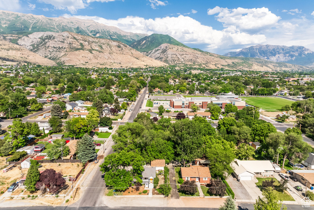 Aerial view of residential area featuring a mountainous background