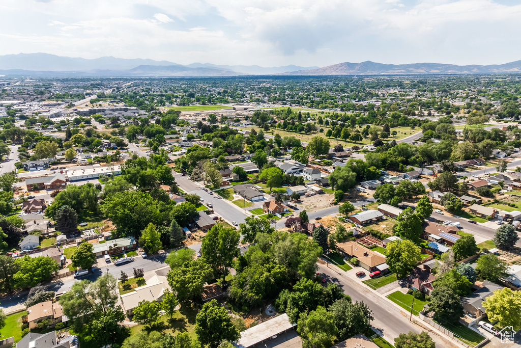 Aerial perspective of suburban area featuring a mountainous background
