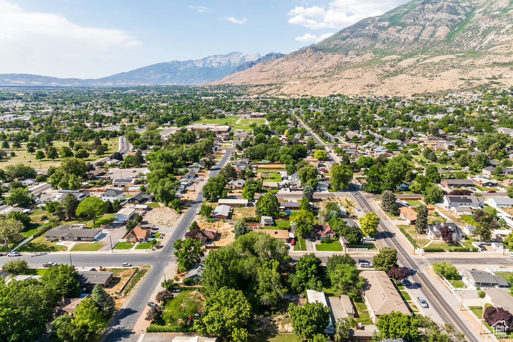 Aerial perspective of suburban area featuring a mountainous background