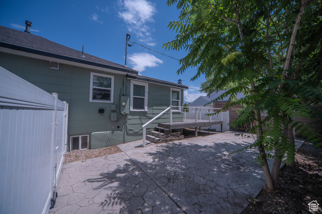 Rear view of property with a patio area and a wooden deck