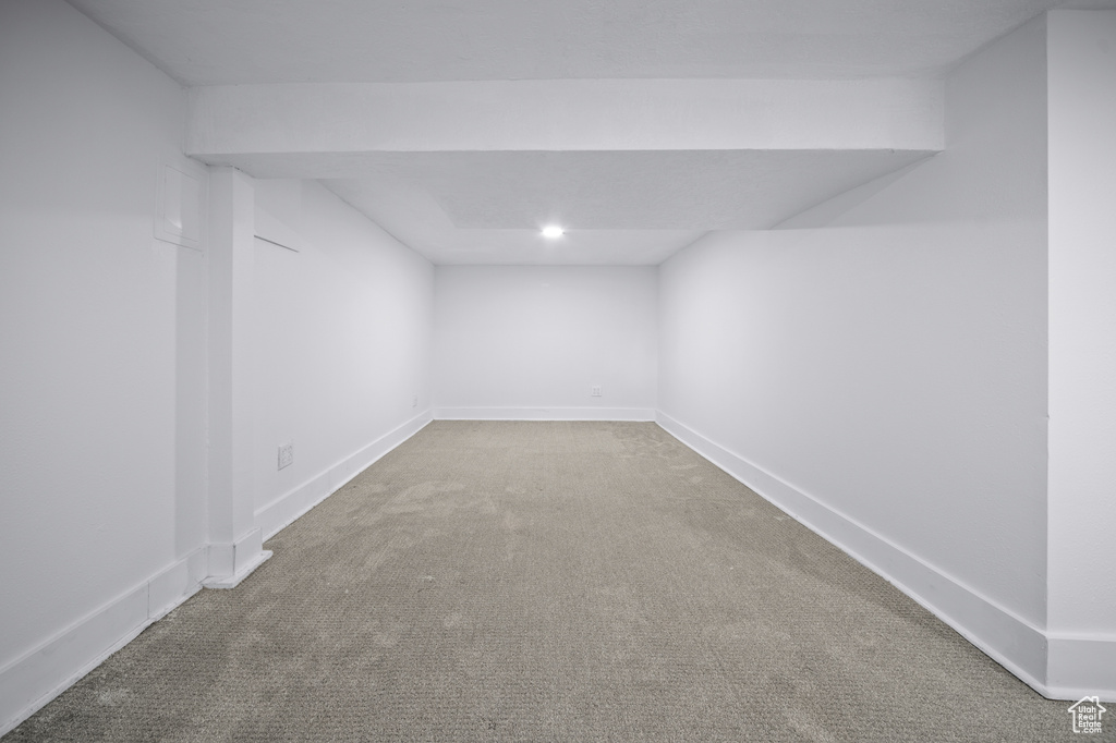 Finished below grade area featuring carpet flooring and recessed lighting