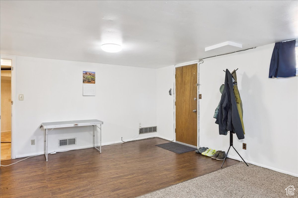 Entrance foyer featuring wood finished floors and baseboards