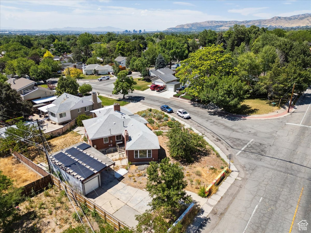 Aerial perspective of suburban area with a mountainous background