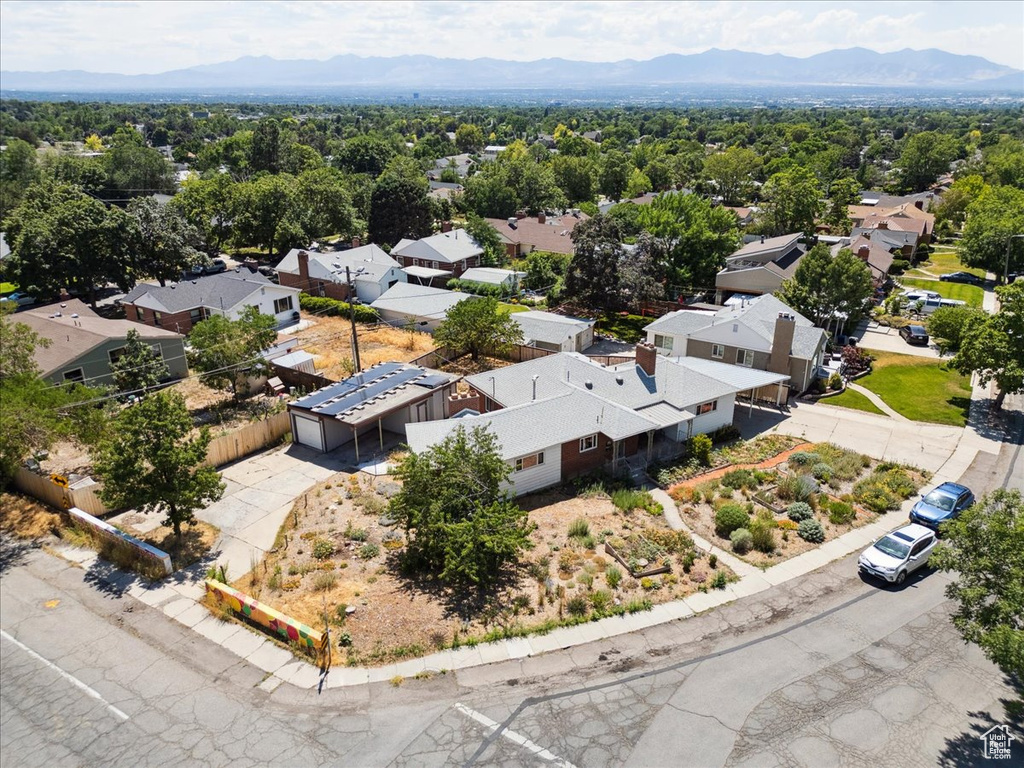 Aerial view of residential area featuring a mountainous background
