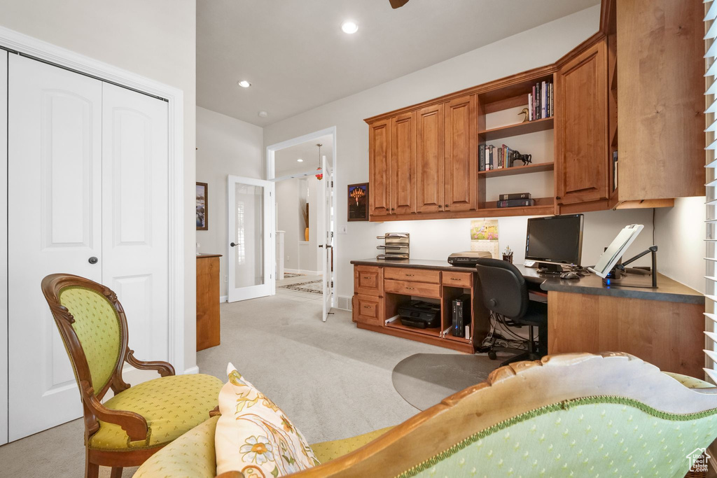 Office area featuring light carpet, recessed lighting, and built in study area