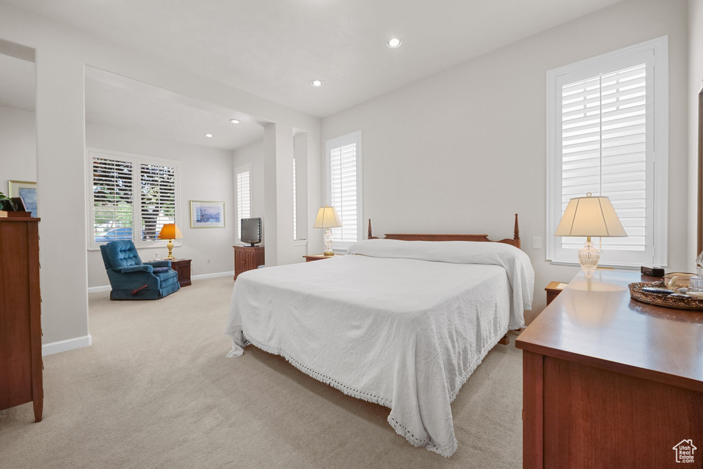 Bedroom featuring recessed lighting and light carpet