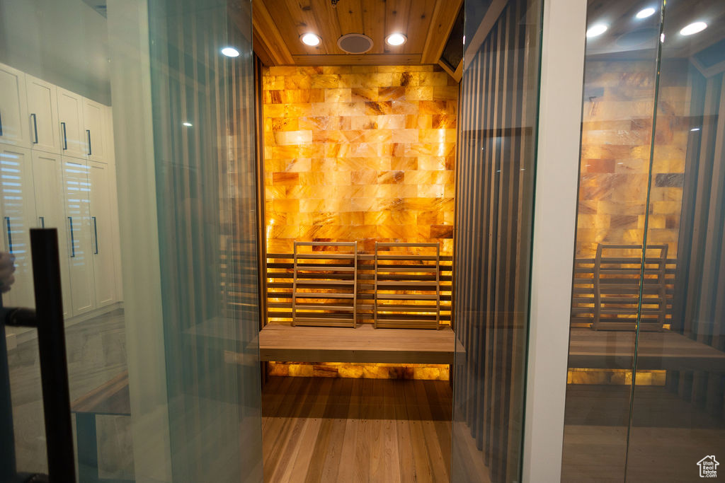 Relaxing sauna / steam room featuring wood finished floors