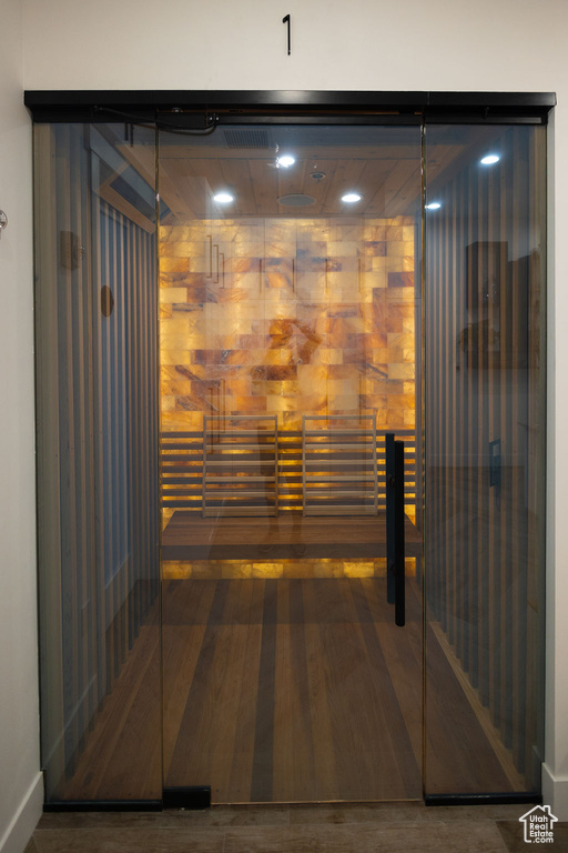 Sauna / steam room with wood finished floors