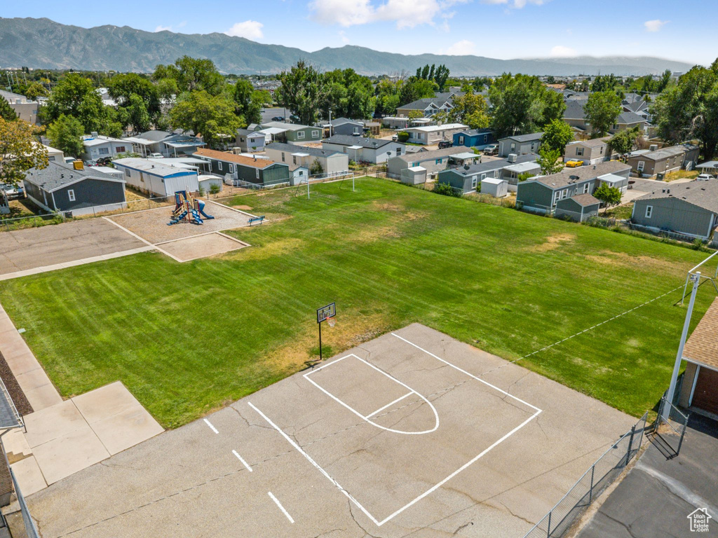 Aerial view of residential area featuring a mountainous background