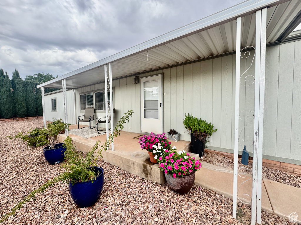 Property entrance featuring covered porch
