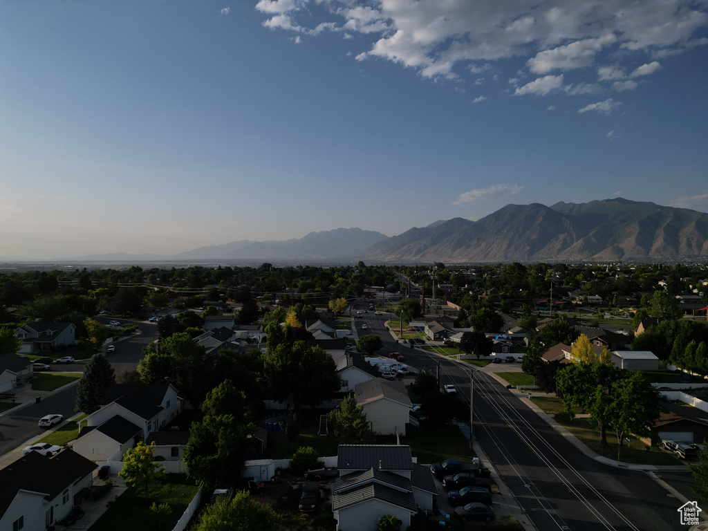 Aerial overview of property's location with nearby suburban area and mountains