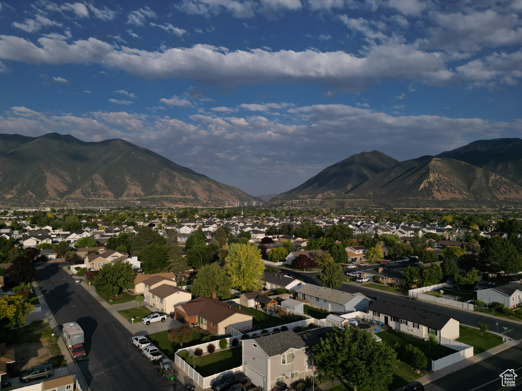 View of mountain backdrop featuring nearby suburban area