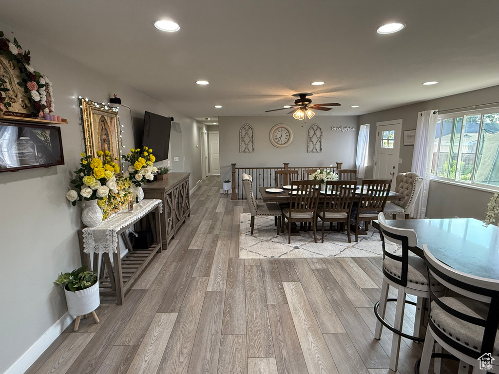Dining area with recessed lighting, light wood-type flooring, and ceiling fan