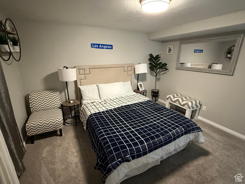 Carpeted bedroom with baseboards