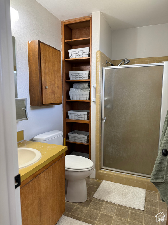Bathroom with a stall shower and vanity