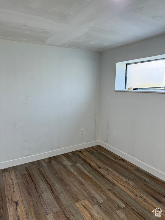 Spare room with wood finished floors
