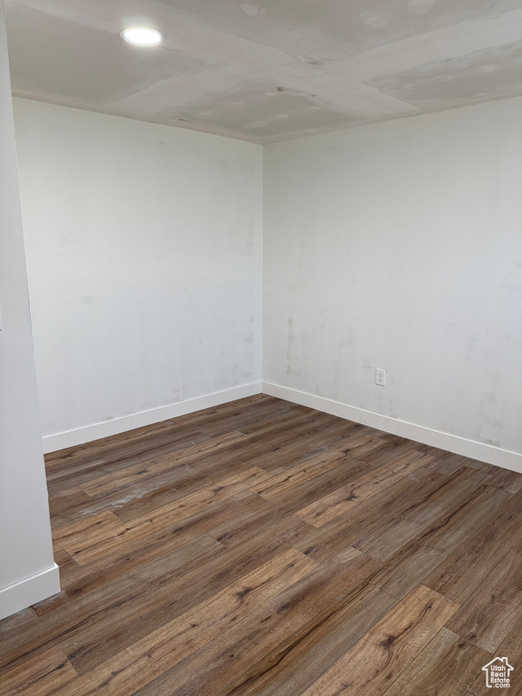 Unfurnished room featuring wood finished floors and recessed lighting
