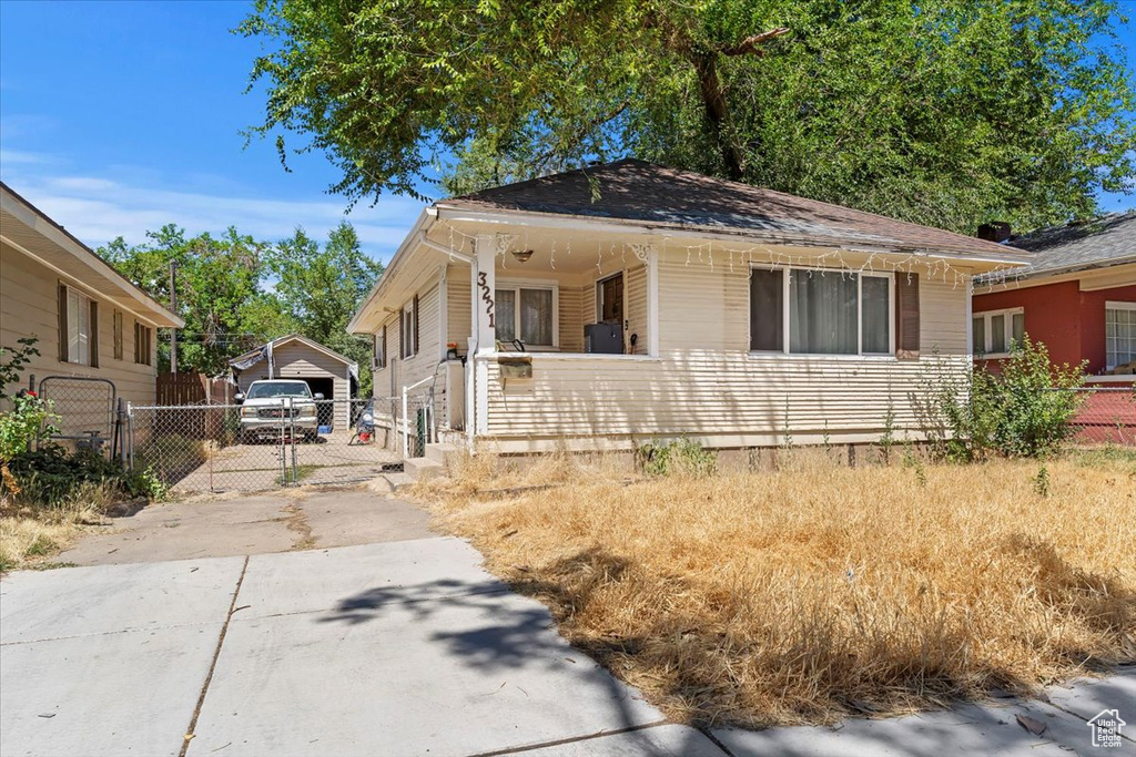 Bungalow-style house with driveway and a garage