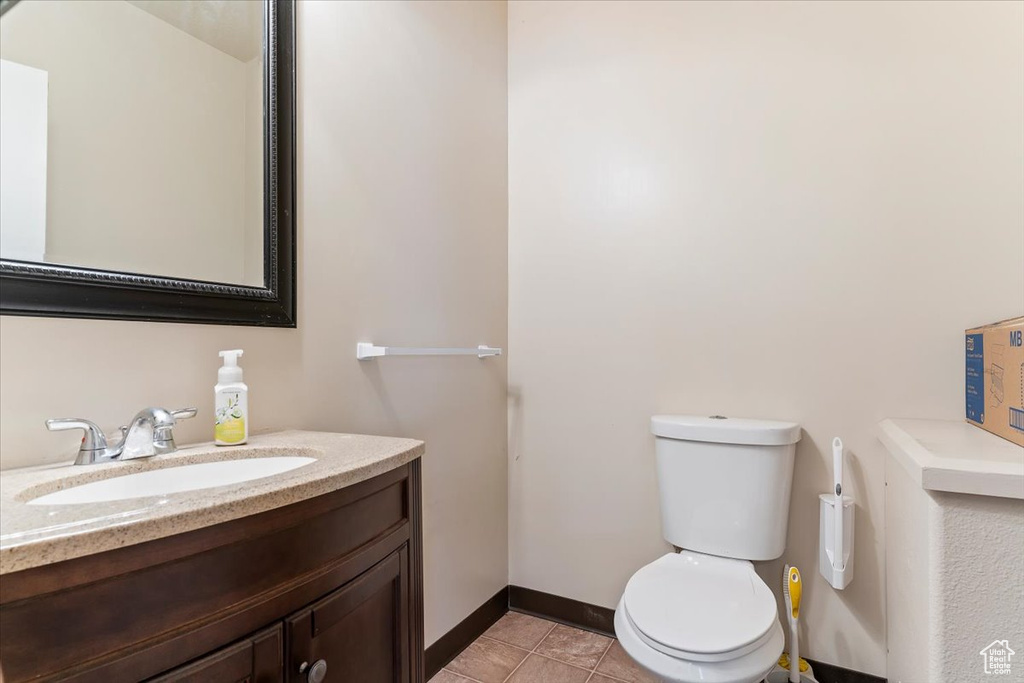 Bathroom featuring vanity and tile patterned flooring