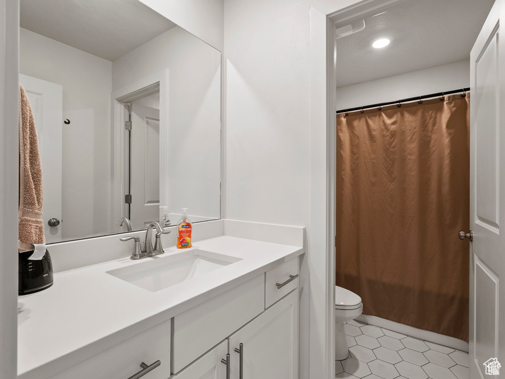 Bathroom featuring vanity and tile patterned flooring