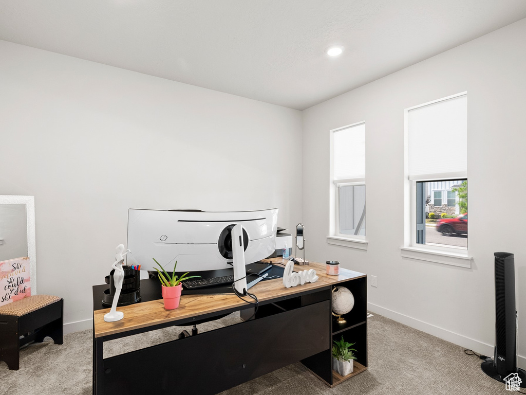 Office space with light colored carpet