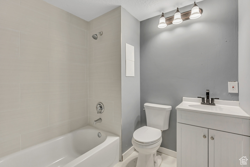 Bathroom featuring shower / bath combination and vanity