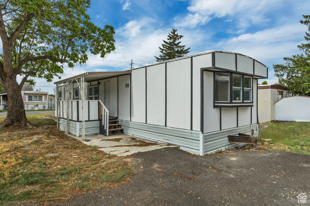 View of side of property featuring board and batten siding