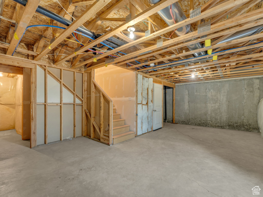 Unfinished basement with stairway