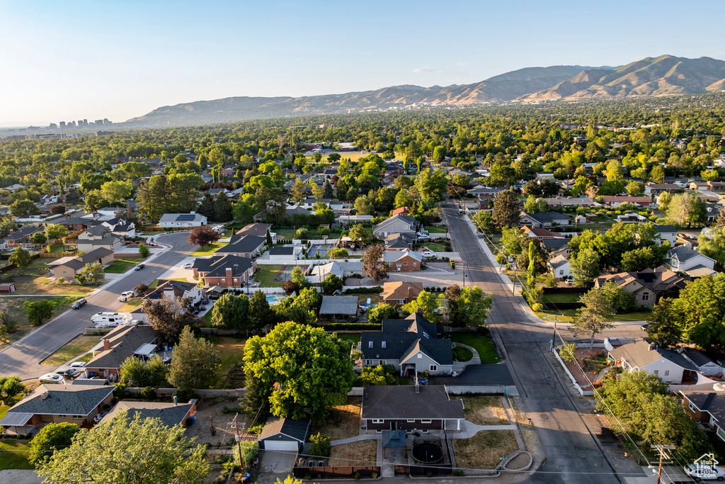 View of property location featuring a mountain backdrop and nearby suburban area