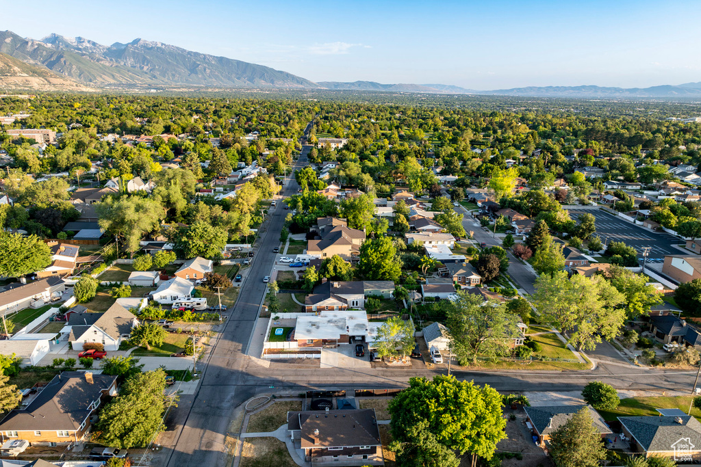 Aerial perspective of suburban area with a mountainous background