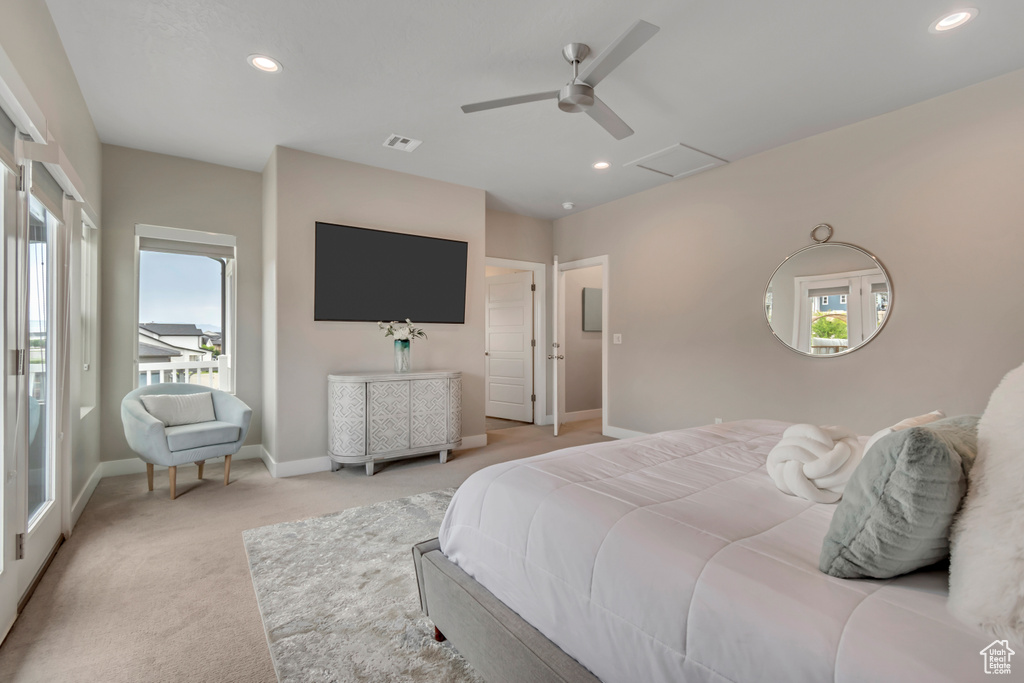 Bedroom with light colored carpet, multiple windows, ceiling fan, and recessed lighting