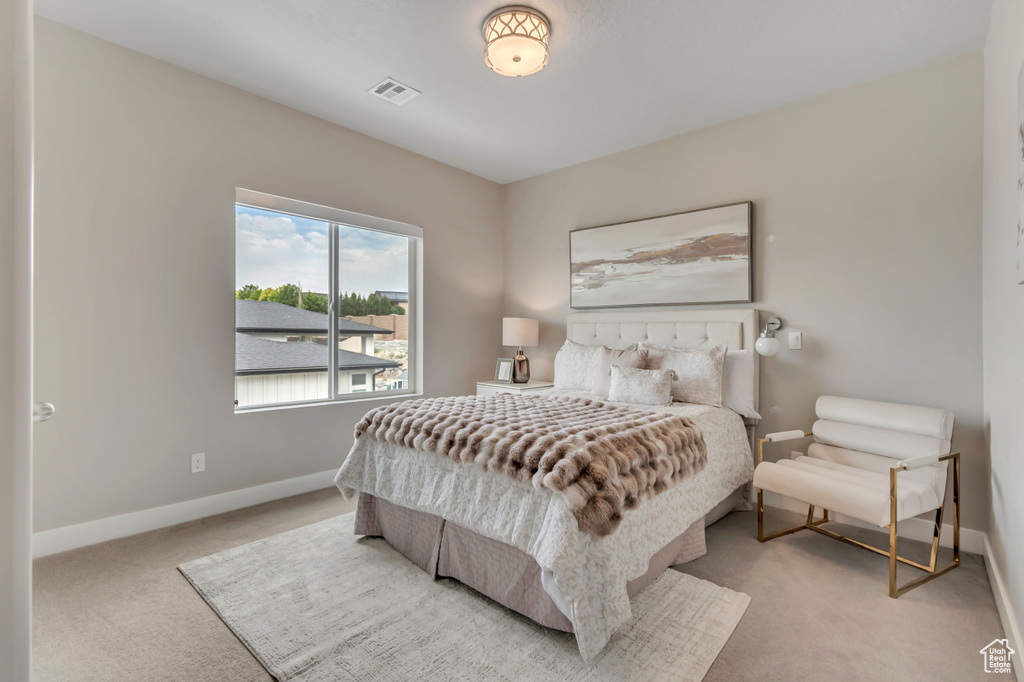 Carpeted bedroom featuring baseboards