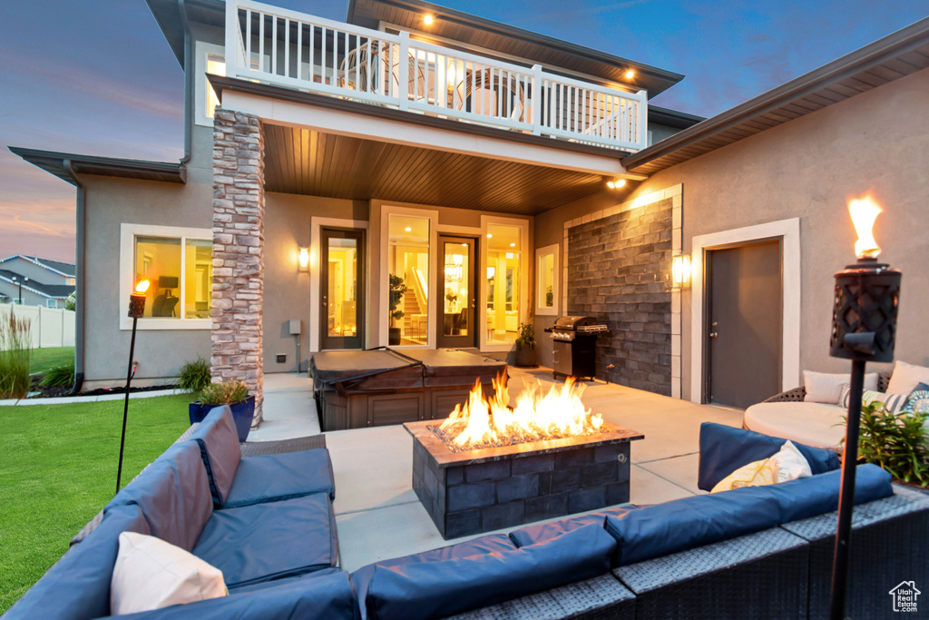 Patio / terrace with an outdoor living space with a fire pit, a patio, grilling area, and a yard