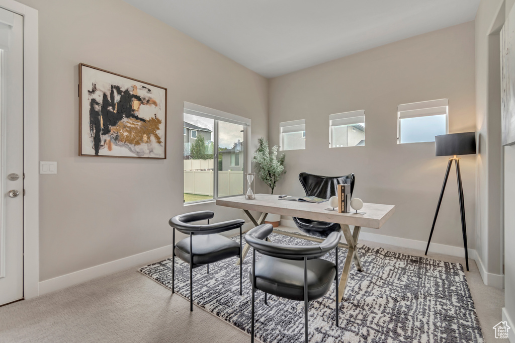 Office with baseboards and carpet flooring