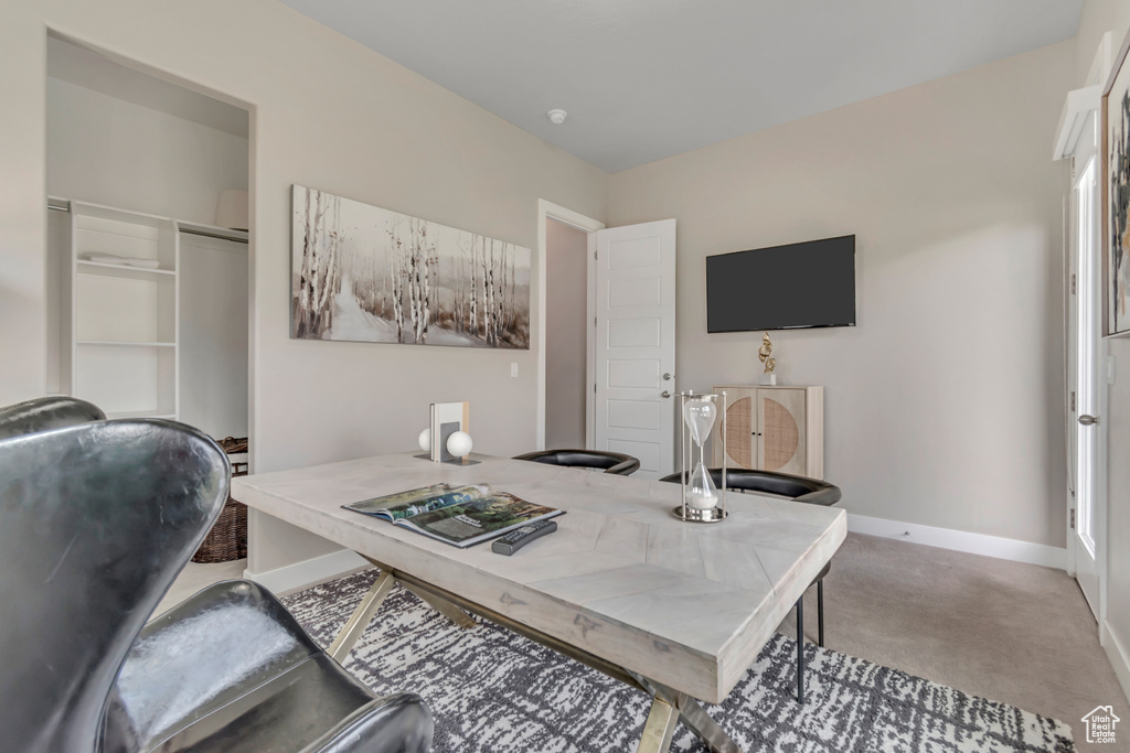 Office space with carpet and baseboards