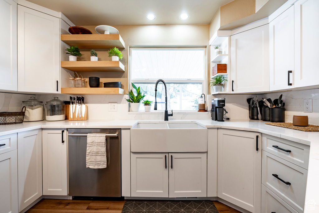 Kitchen featuring stainless steel dishwasher, recessed lighting, open shelves, and white cabinetry