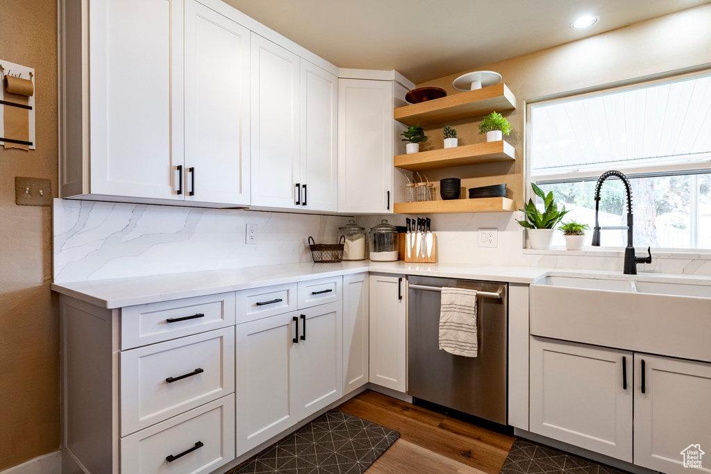 Kitchen with dishwasher, dark wood-style flooring, tasteful backsplash, white cabinets, and recessed lighting