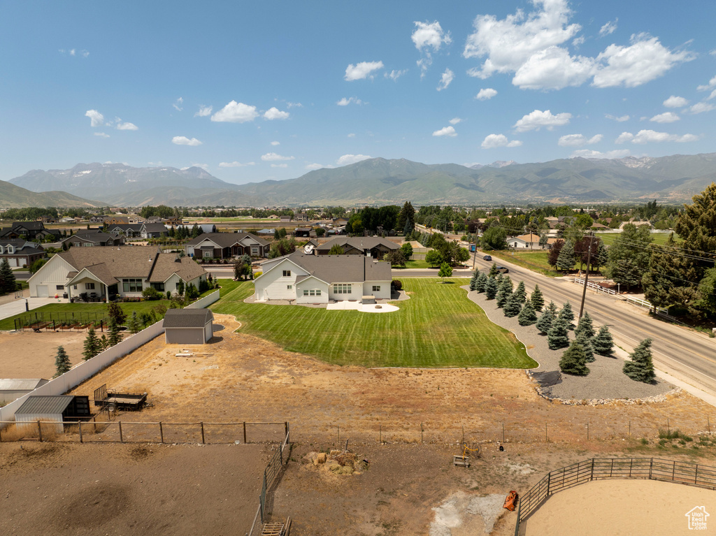 Aerial view of residential area featuring a mountain backdrop