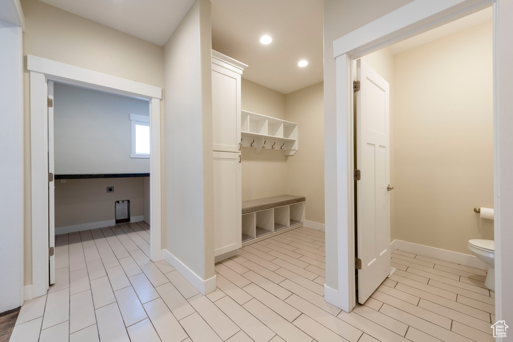 Mudroom featuring recessed lighting and baseboards