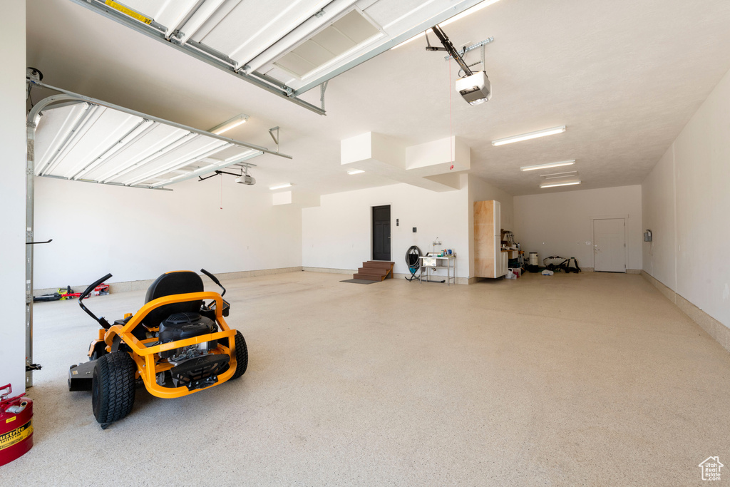 Garage featuring a garage door opener