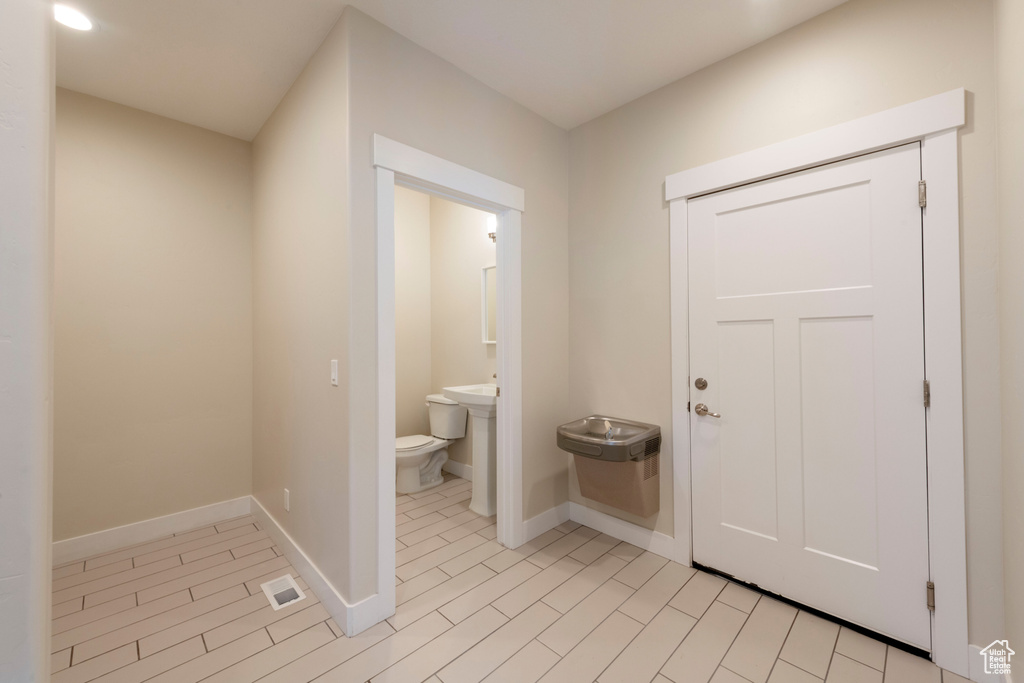 Half bath featuring baseboards